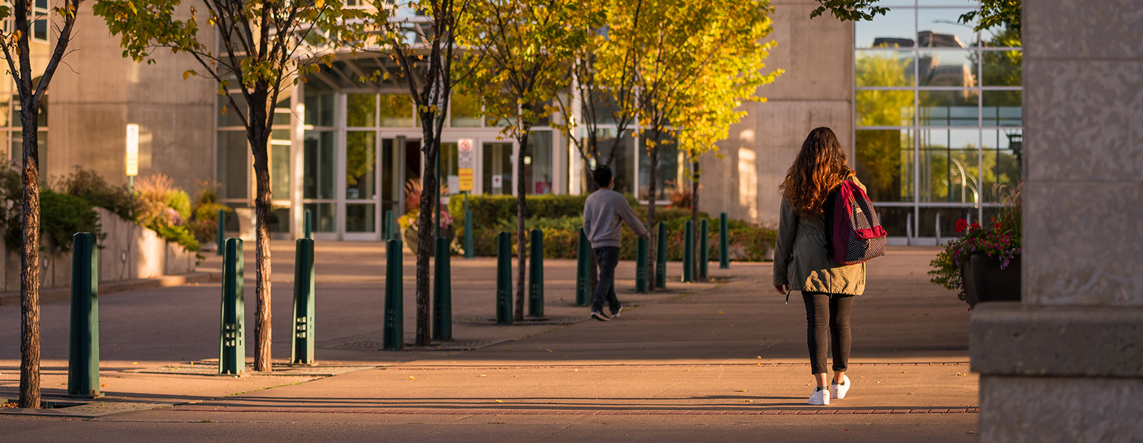 sunrise with student walking outside MacEwan