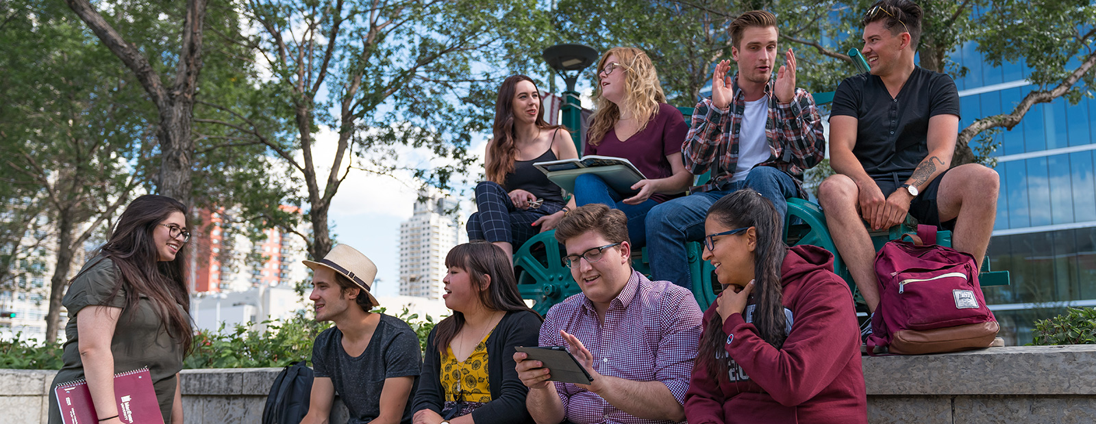 students sitting outside