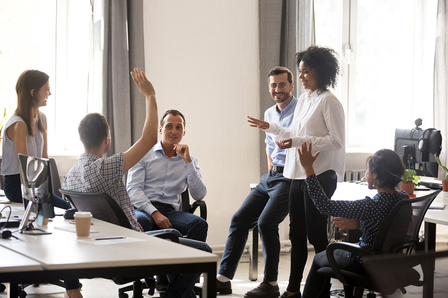 group of people talking in office