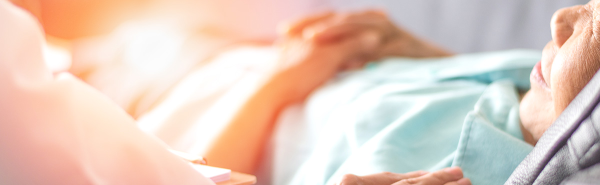 close up of elderly woman in hospital bed