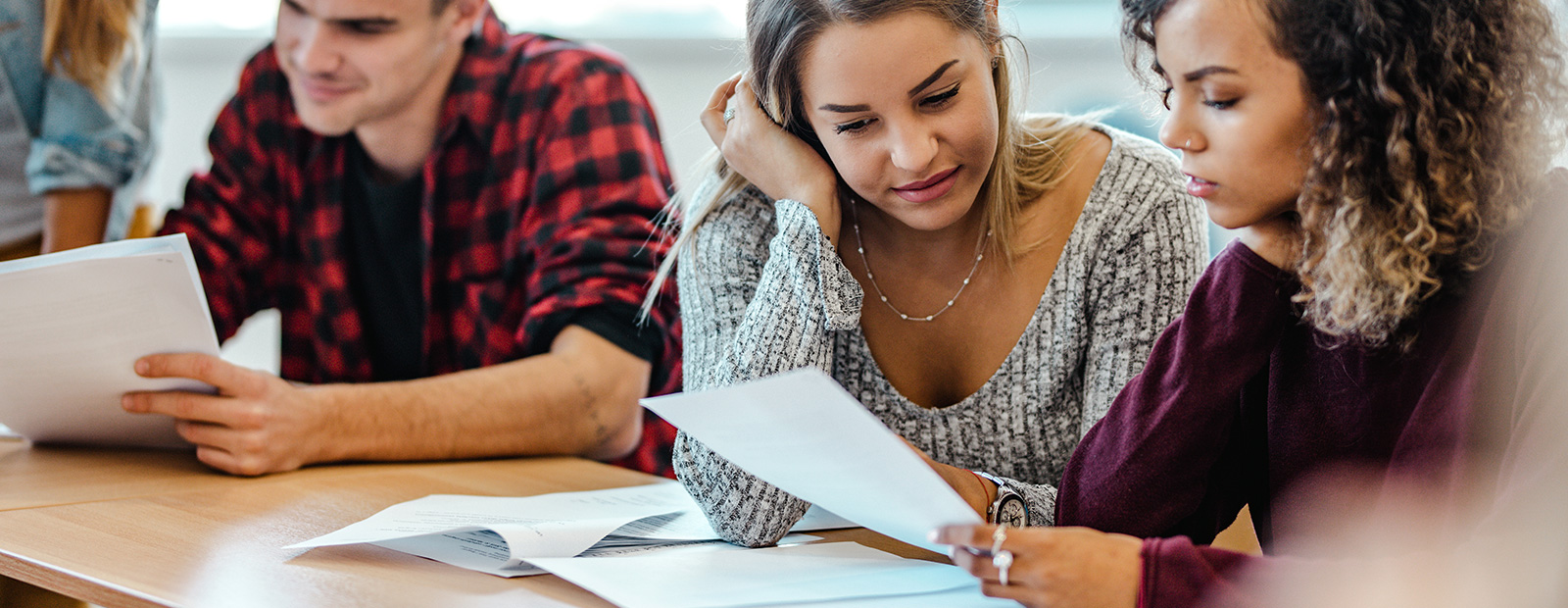 students looking at papers