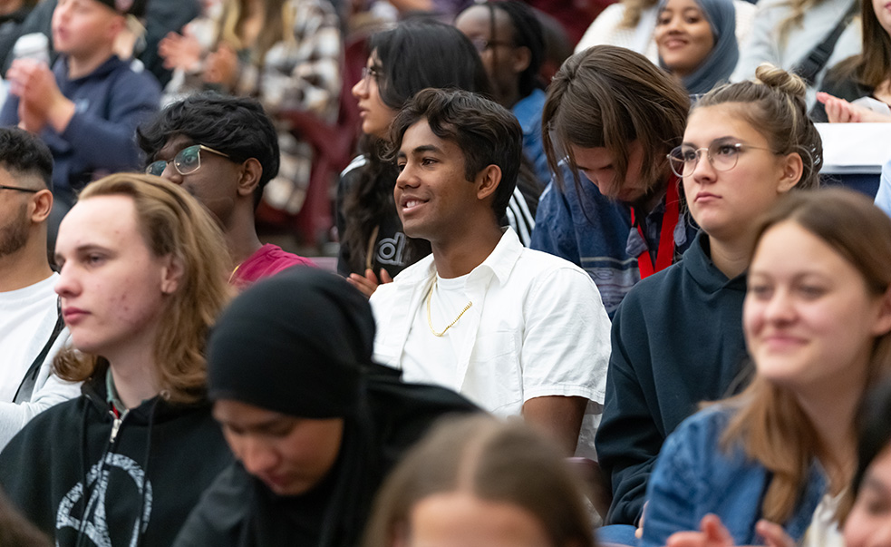 Students sitting in gynmasium