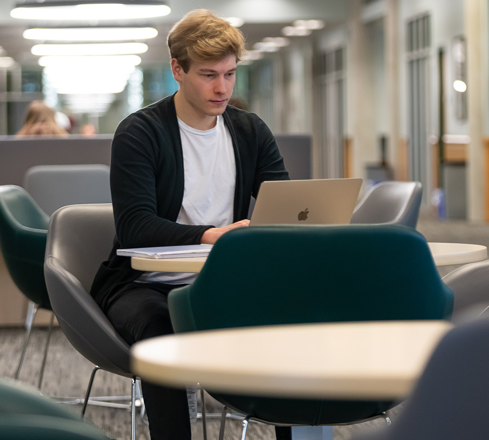 male student on laptop