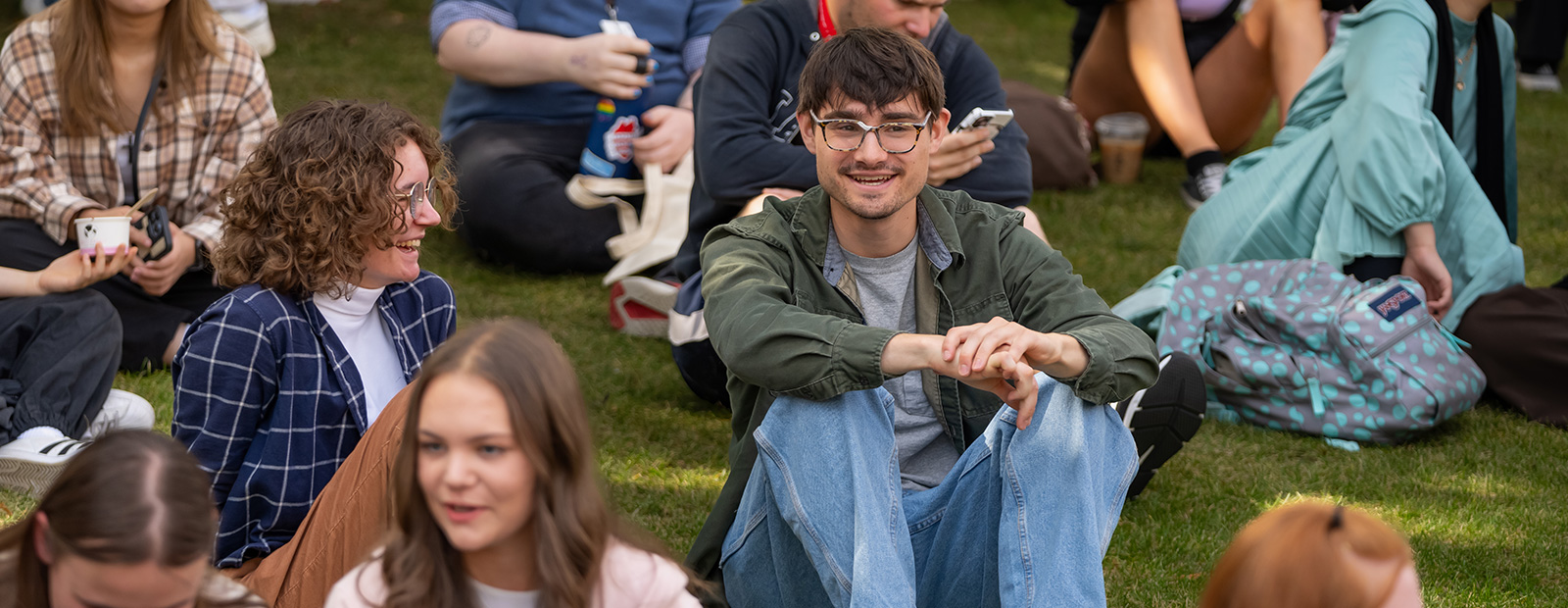 students sitting outside of MacEwan University