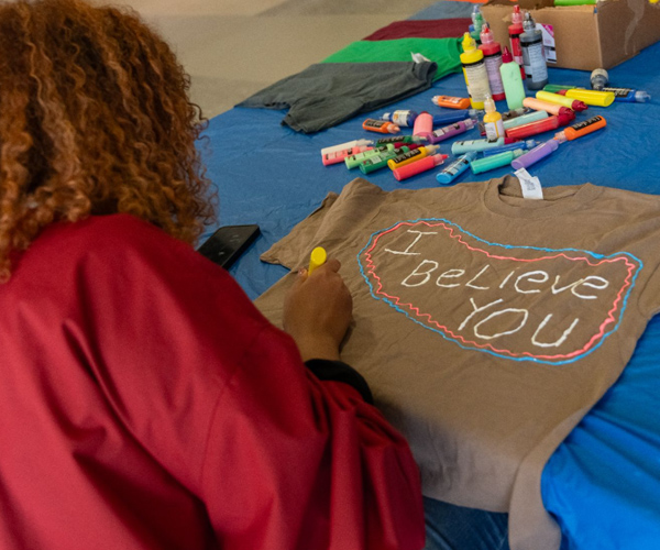 student decorating t-shirt