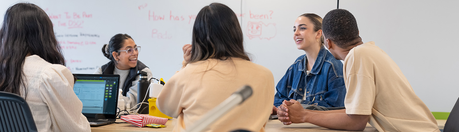 students sitting at table talking