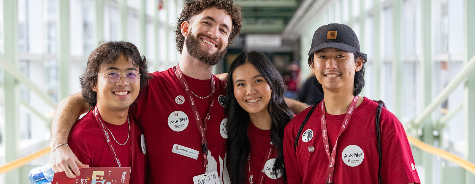 students volunteering and smiling in pedway