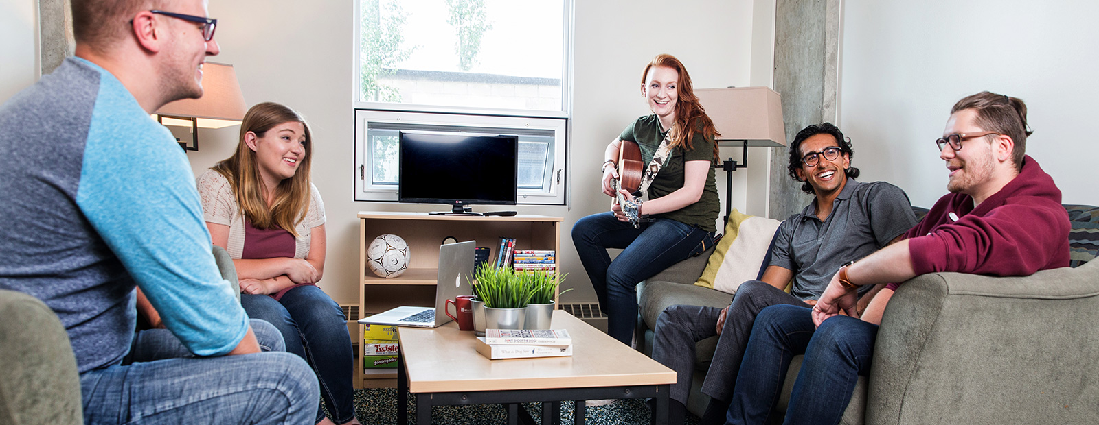 Students sitting and chatting in residence