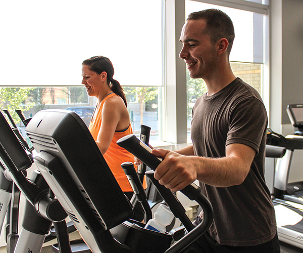 people working out on fitness machines