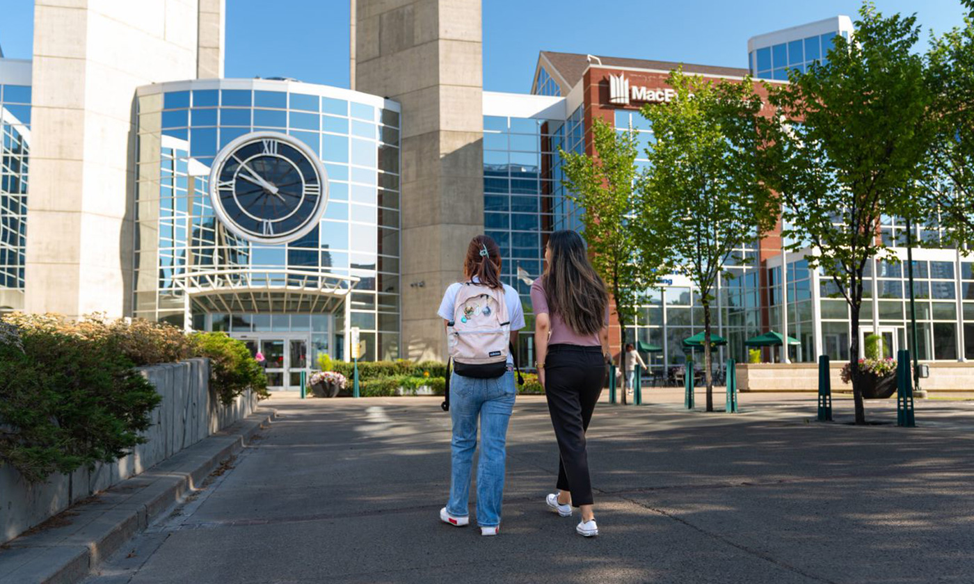 students walking outside on campus