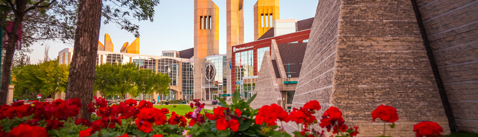 students walking outside with macewan in background